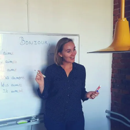 Léa teaching French at the whiteboard in 2017