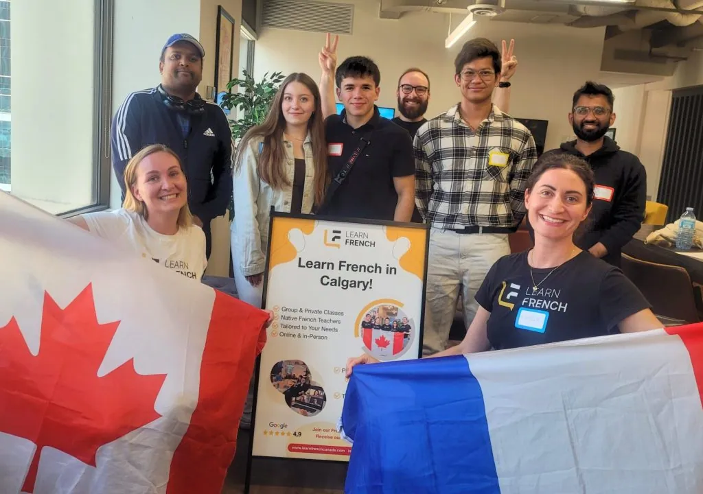 Launching Learn French Canada city classrooms: students with Canadian and French flags