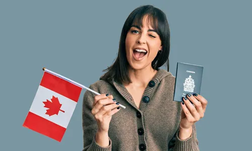 Woman celebrating Canadian permanent residency — holding a Canadian flag and passport after earning express entry points for French