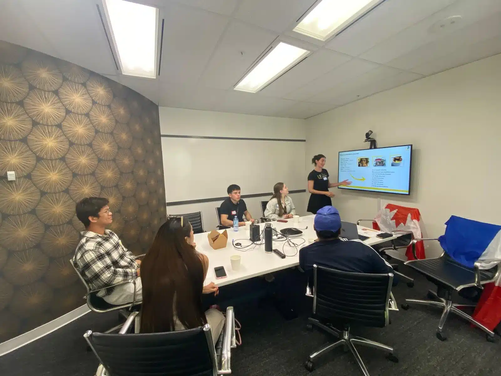 TEF vs TCF — French class at Learn French Canada with Canadian and French flags preparing for TEF TCF exams