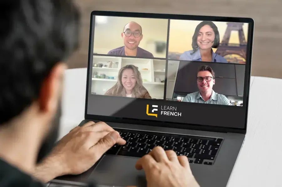 A student taking a live online French class from home