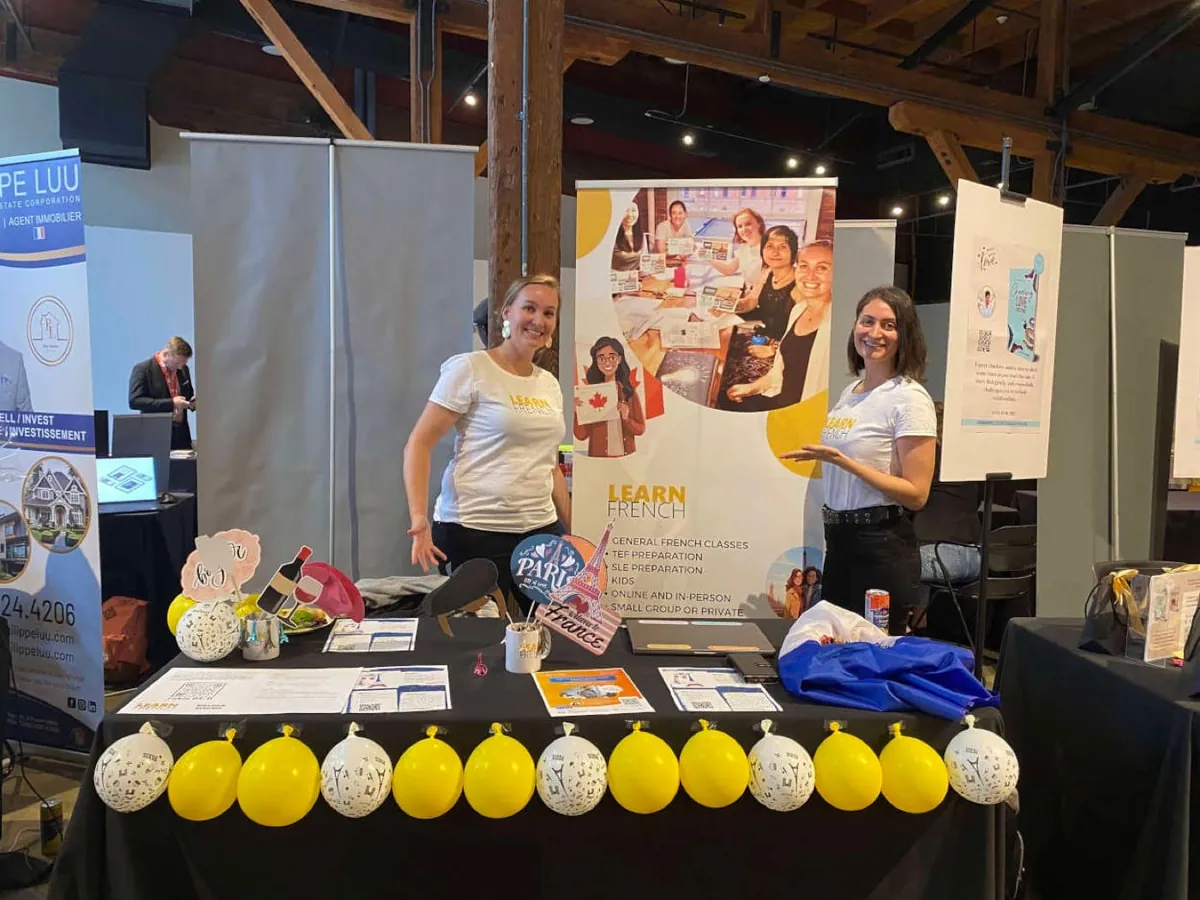 Learn French team at a francophone community event