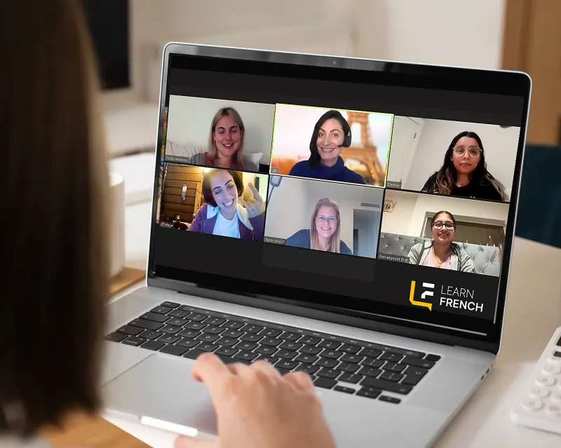 Students in a live online French class on a laptop